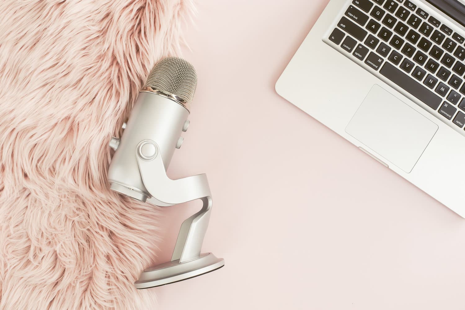 microphone-and-laptop-on-pink-background