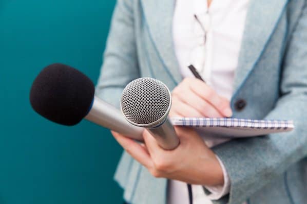 Press-with-microphones-writing-notes